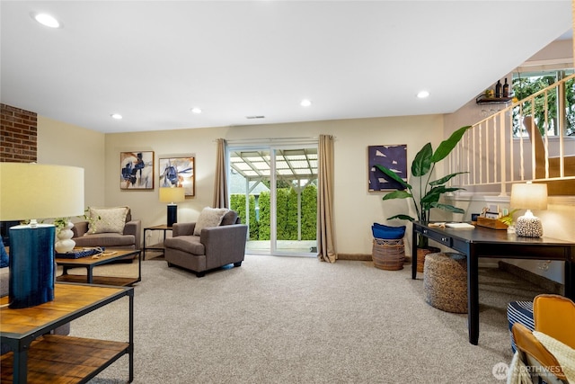 carpeted living room featuring baseboards and recessed lighting