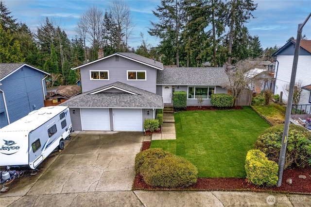 split level home featuring an attached garage, roof with shingles, concrete driveway, and a front yard