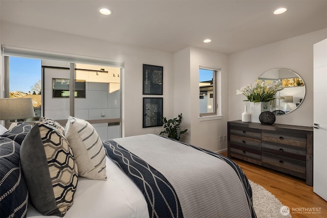 bedroom featuring recessed lighting and wood finished floors