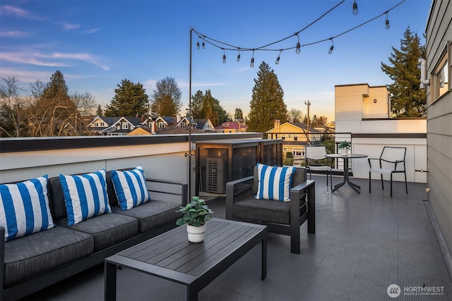 view of patio / terrace with a balcony and an outdoor hangout area