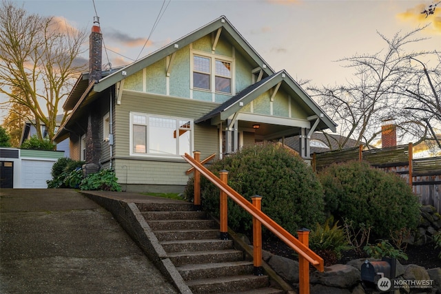 view of front of house with an outbuilding