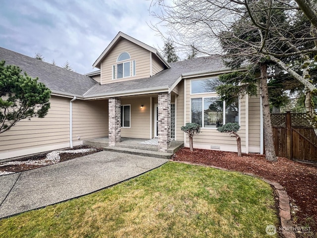 view of front of property featuring crawl space, a front yard, fence, and roof with shingles