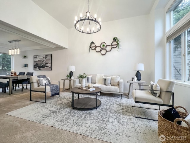 carpeted living area featuring a chandelier, plenty of natural light, and baseboards