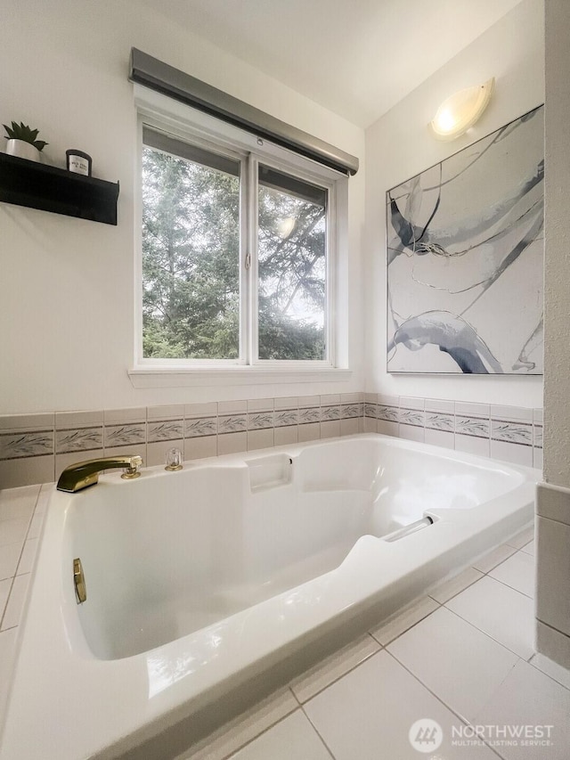 bathroom featuring a garden tub and tile patterned floors