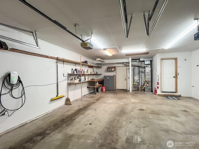 garage with water heater and a garage door opener