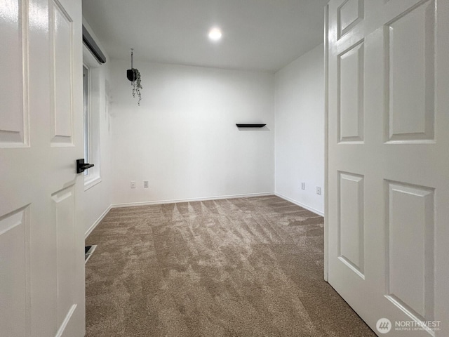 empty room with carpet, visible vents, baseboards, and recessed lighting