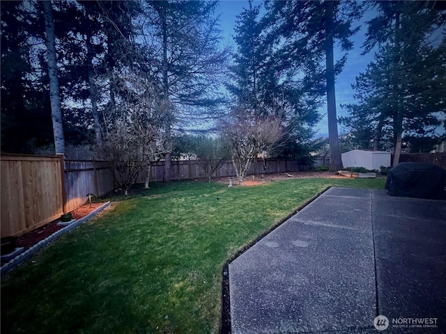 view of yard with a fenced backyard