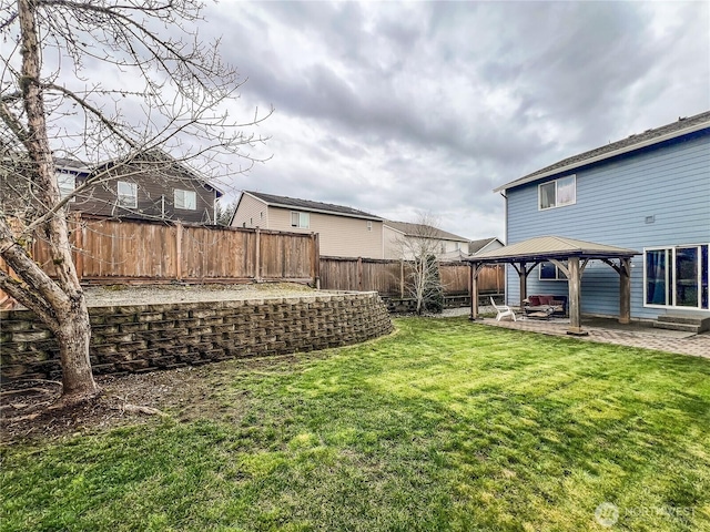 view of yard featuring a gazebo, a patio, and a fenced backyard