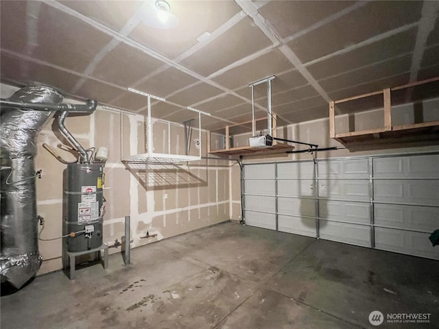 garage featuring water heater and a garage door opener