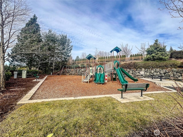 communal playground featuring a lawn