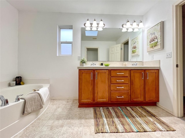 bathroom featuring tile patterned flooring, baseboards, double vanity, a bath, and a sink