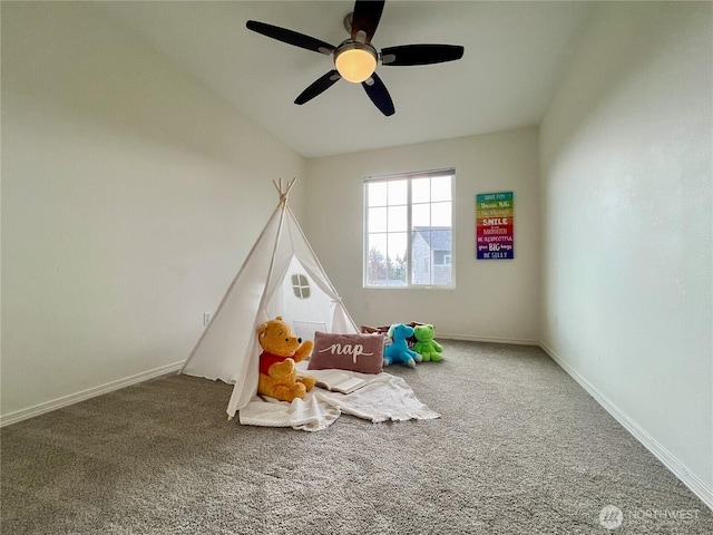 recreation room with baseboards and carpet floors