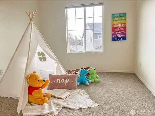 game room with baseboards and carpet floors