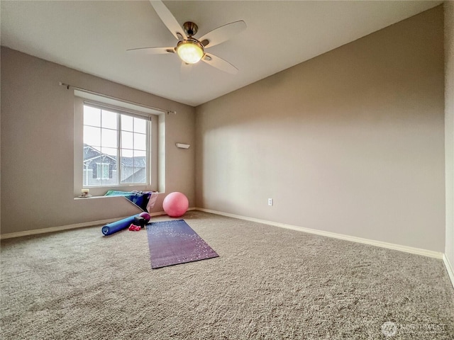 workout area with ceiling fan, baseboards, and carpet floors