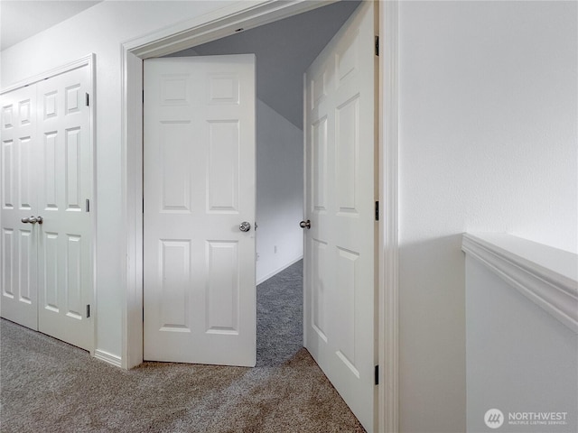 hallway with carpet floors