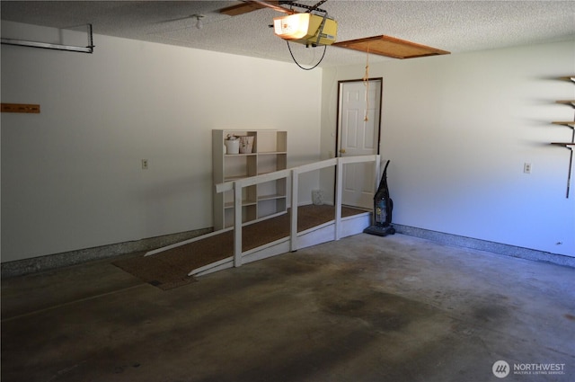 garage featuring baseboards and a garage door opener