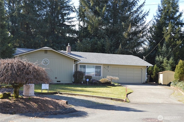 ranch-style home with a chimney, an attached garage, crawl space, driveway, and a front lawn