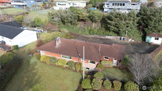 birds eye view of property with a residential view