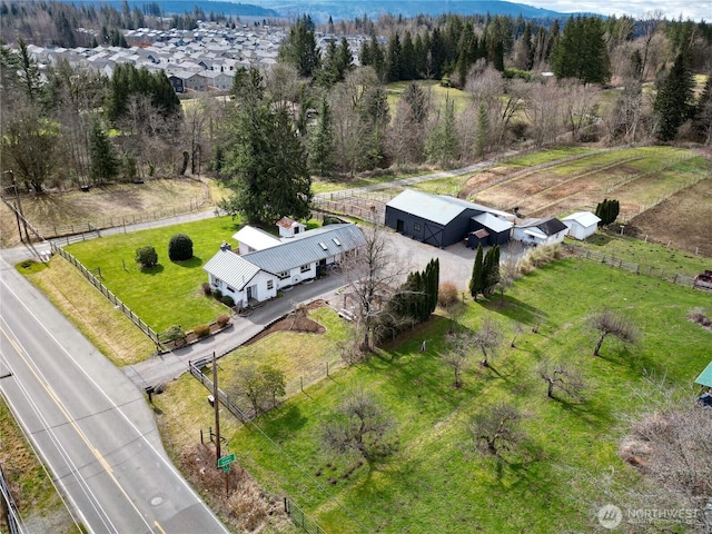 bird's eye view with a wooded view