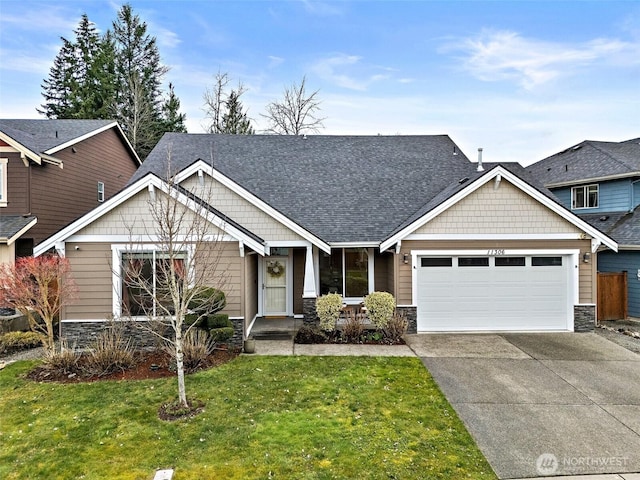 craftsman inspired home with a front yard, roof with shingles, concrete driveway, a garage, and stone siding