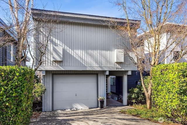 view of front of home with driveway and an attached garage