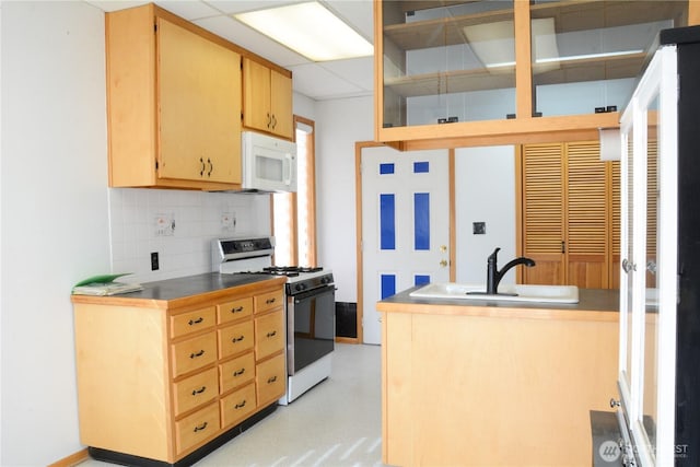 kitchen with white appliances, a sink, decorative backsplash, and light brown cabinetry