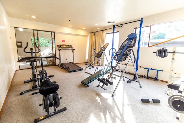 workout area with recessed lighting, visible vents, and baseboards