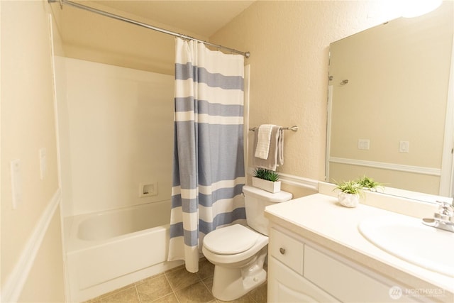 full bath with a textured wall, toilet, tile patterned flooring, shower / bath combination with curtain, and vanity