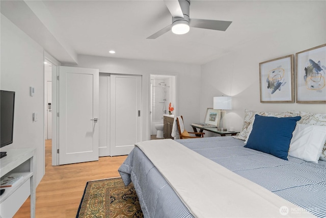 bedroom with ensuite bathroom, recessed lighting, a ceiling fan, light wood-style floors, and a closet