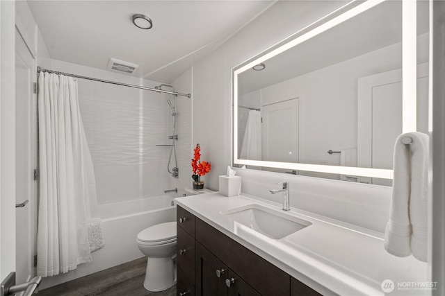 full bath with visible vents, toilet, shower / bath combo, vanity, and wood finished floors