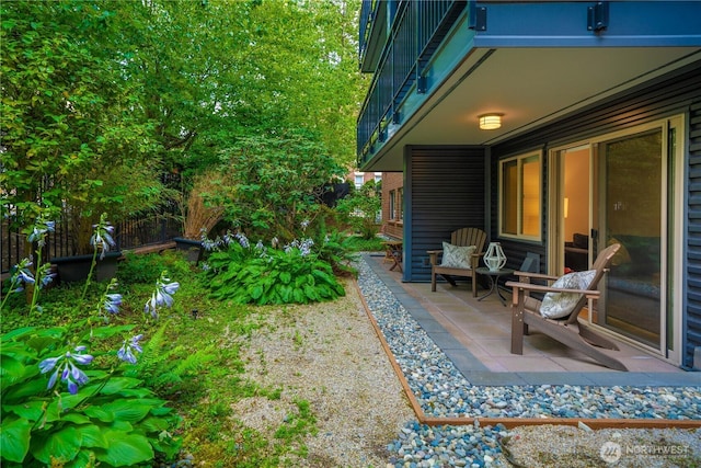 view of yard featuring fence and a patio