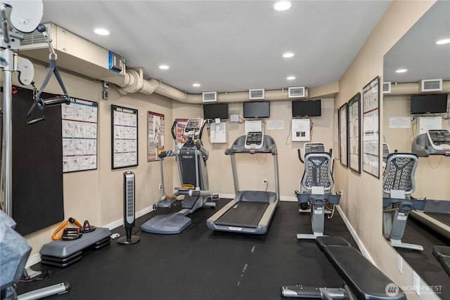 exercise room with recessed lighting, visible vents, and baseboards