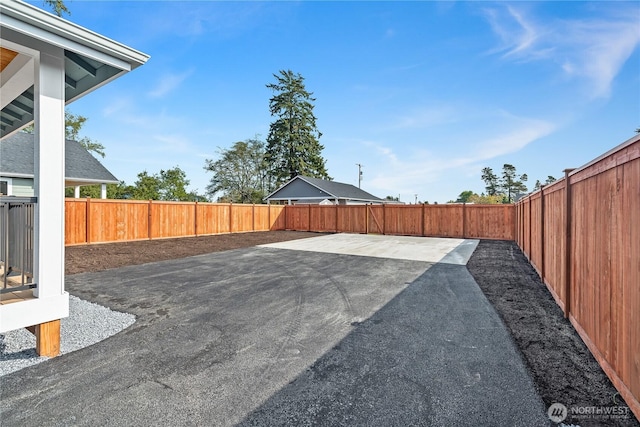 view of yard featuring a patio area and a fenced backyard