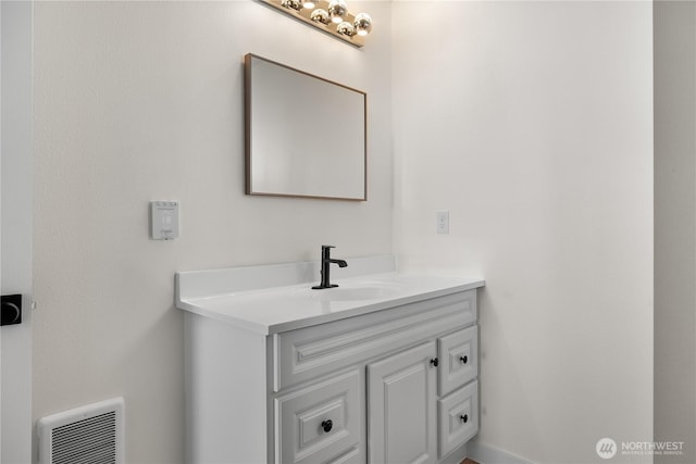 bathroom with visible vents and vanity