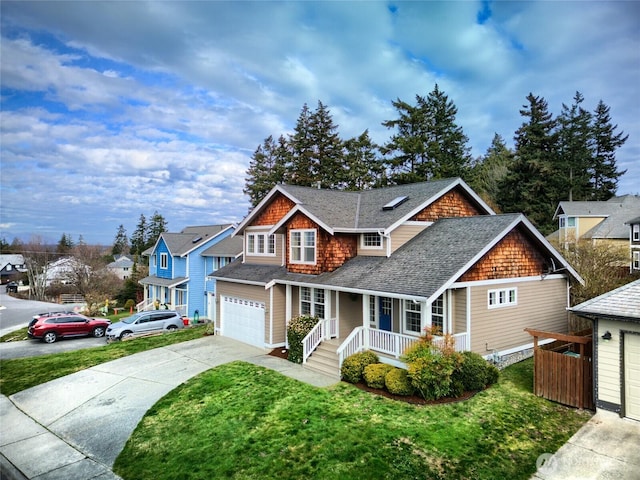 view of front of home with roof with shingles, covered porch, a residential view, driveway, and a front lawn