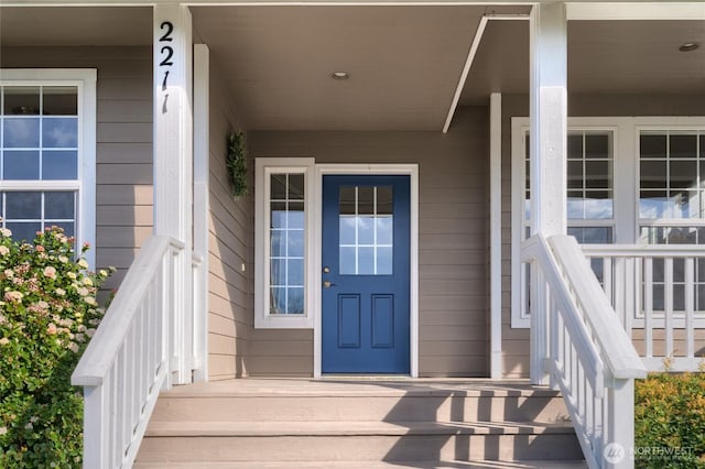 doorway to property with covered porch