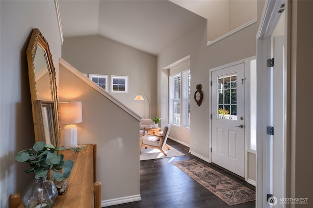 entrance foyer with stairs, baseboards, vaulted ceiling, and dark wood-type flooring