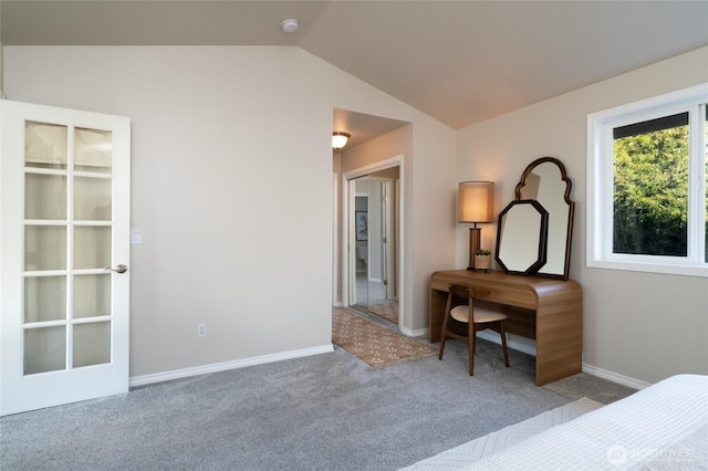 bedroom with lofted ceiling, baseboards, and carpet floors