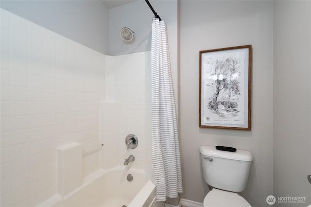 bathroom featuring shower / bathtub combination with curtain and toilet