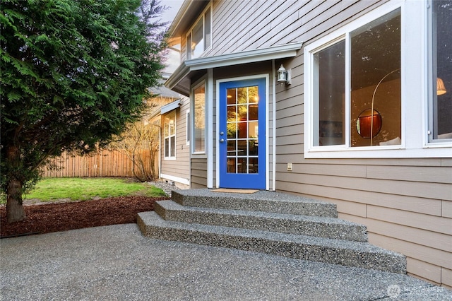 property entrance with fence