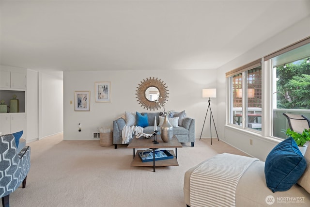 living room featuring carpet and visible vents