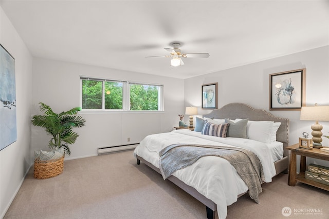 carpeted bedroom with a baseboard radiator, baseboards, and ceiling fan