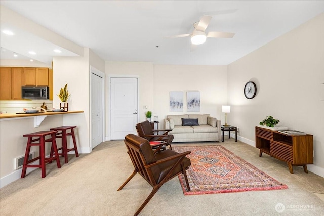 living room with recessed lighting, visible vents, light carpet, ceiling fan, and baseboards