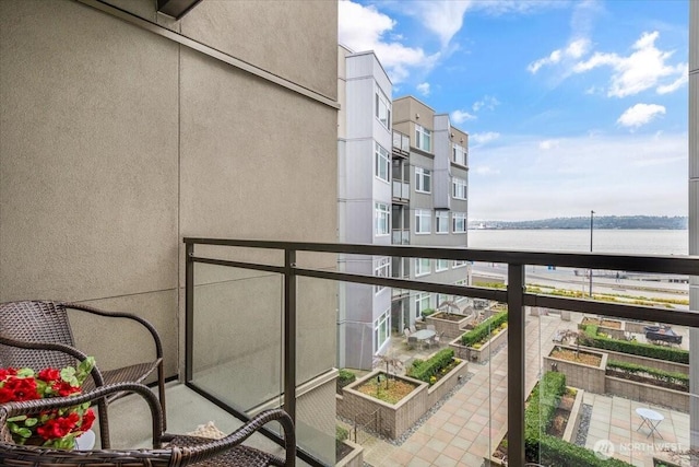 balcony featuring a water view