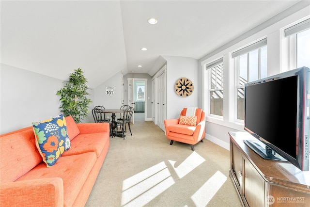 living area with vaulted ceiling, light carpet, baseboards, and recessed lighting