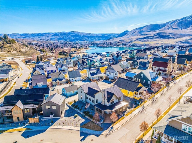 bird's eye view featuring a residential view and a water and mountain view