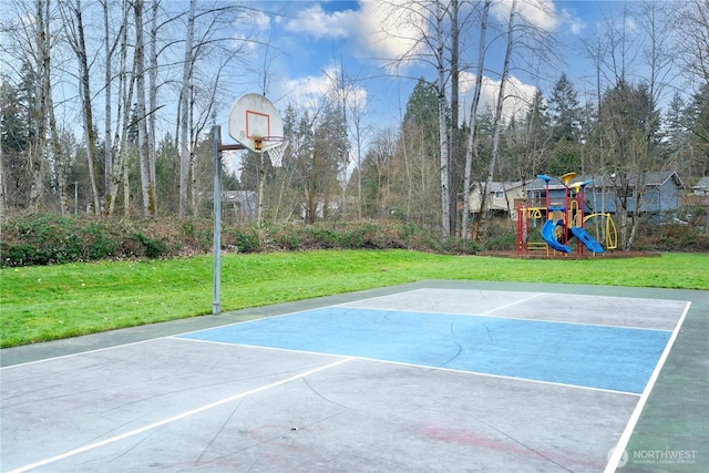 view of basketball court featuring a yard, playground community, and community basketball court