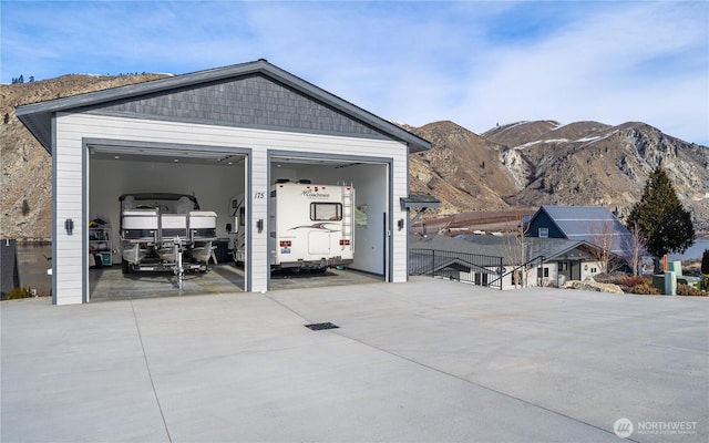 detached garage featuring a mountain view