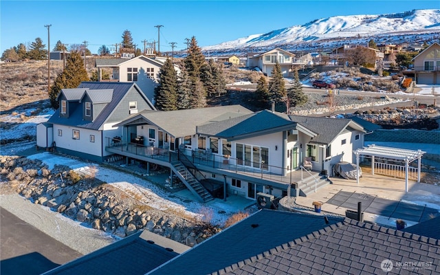 birds eye view of property with a residential view and a mountain view