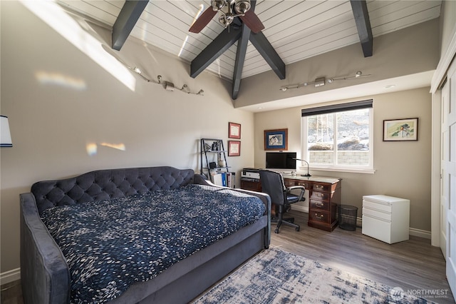 bedroom with wood ceiling, wood finished floors, baseboards, and ceiling fan